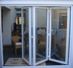 white bi folding doors