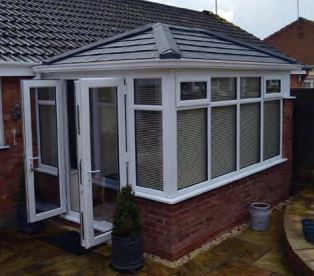 Sentinel roof on white upvc conservatory installation