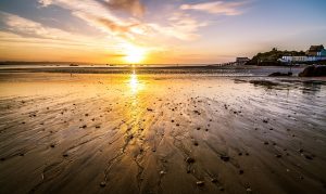 Tenby beach with sunset reflection